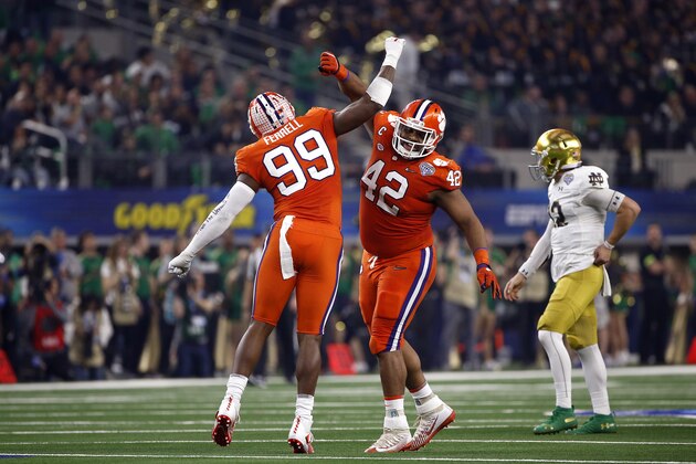 ARLINGTON, TEXAS - DECEMBER 29: Clelin Ferrell #99 and Christian Wilkins #42 of the Clemson Tigers react after a sack in the first half against the Notre Dame Fighting Irish during the College Football Playoff Semifinal Goodyear Cotton Bowl Classic at AT&T Stadium on December 29, 2018 in Arlington, Texas. (Photo by Ron Jenkins/Getty Images)