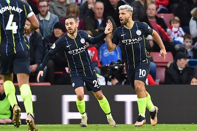 Manchester City's Argentinian striker Sergio Aguero (R) celebrates with Manchester City's Portuguese midfielder Bernardo Silva after scoring their third goal during the English Premier League football match between Southampton and Manchester City at St Mary's Stadium in Southampton, southern England on December 30, 2018. (Photo by Glyn KIRK / AFP) / RESTRICTED TO EDITORIAL USE. No use with unauthorized audio, video, data, fixture lists, club/league logos or 'live' services. Online in-match use limited to 120 images. An additional 40 images may be used in extra time. No video emulation. Social media in-match use limited to 120 images. An additional 40 images may be used in extra time. No use in betting publications, games or single club/league/player publications. /         (Photo credit should read GLYN KIRK/AFP/Getty Images)