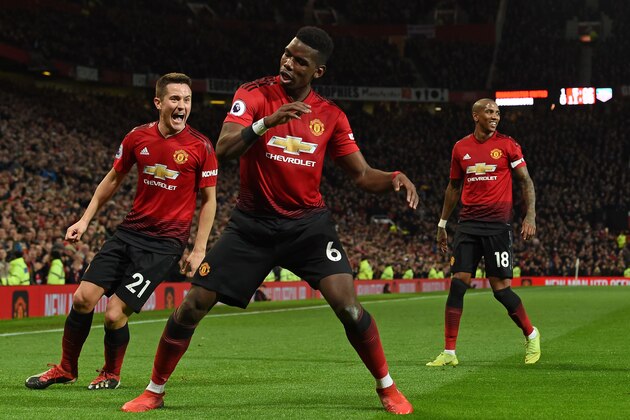 Manchester United's French midfielder Paul Pogba (C) celebrates after scoring their second goal during the English Premier League football match between Manchester United and Bournemouth at Old Trafford in Manchester, north west England, on December 30, 2018. (Photo by Paul ELLIS / AFP) / RESTRICTED TO EDITORIAL USE. No use with unauthorized audio, video, data, fixture lists, club/league logos or 'live' services. Online in-match use limited to 120 images. An additional 40 images may be used in extra time. No video emulation. Social media in-match use limited to 120 images. An additional 40 images may be used in extra time. No use in betting publications, games or single club/league/player publications. /         (Photo credit should read PAUL ELLIS/AFP/Getty Images)