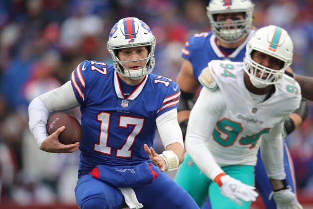 BUFFALO, NY - DECEMBER 30: Josh Allen #17 of the Buffalo Bills runs with the ball in the second quarter during NFL game action as he is chased by Robert Quinn #94 of the Miami Dolphins at New Era Field on December 30, 2018 in Buffalo, New York. (Photo by Tom Szczerbowski/Getty Images)