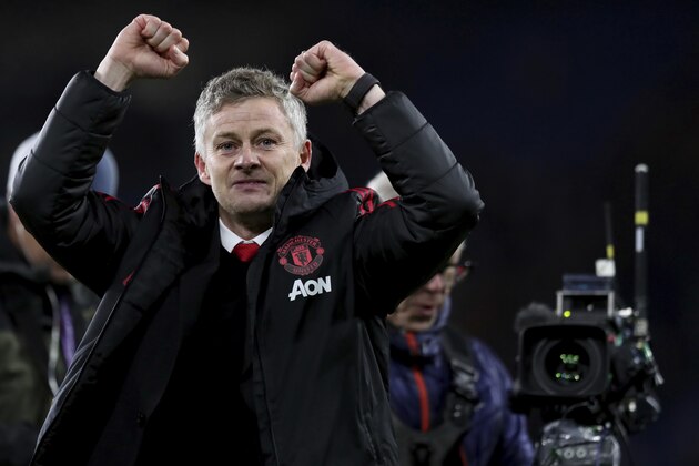 Manchester United manager Ole Gunnar Solskjaer celebrates his win against Cardiff City after the English Premier League match between Cardiff City and Manchester United at the Cardiff City Stadium in Cardiff, Wales, Saturday Dec. 22, 2018. (AP Photo/ Jon Super)