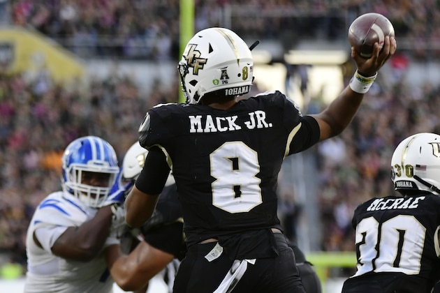 ORLANDO, FLORIDA - DECEMBER 01: Darriel Mack Jr. #8 of the UCF Knights throws a pass during the second quarter of the American Athletic Championship against the Memphis Tigers at Spectrum Stadium on December 01, 2018 in Orlando, Florida. (Photo by Julio Aguilar/Getty Images)