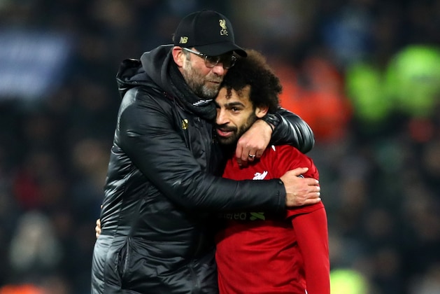 LIVERPOOL, ENGLAND - DECEMBER 11:  Jurgen Klopp, Manager of Liverpool celebrates with Mohamed Salah of Liverpool after the UEFA Champions League Group C match between Liverpool and SSC Napoli at Anfield on December 11, 2018 in Liverpool, United Kingdom.  (Photo by Clive Brunskill/Getty Images)