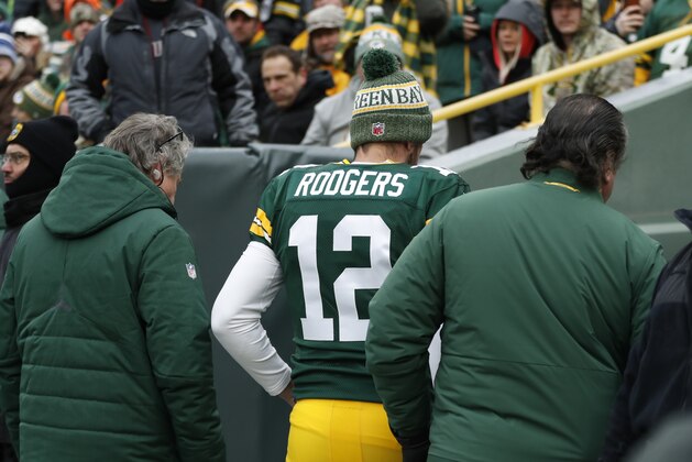 CORRECTS TO REMOVE SCORE- Green Bay Packers' Aaron Rodgers is taken to the locker room to be evaluated during the first half of an NFL football game against the Detroit Lions Sunday, Dec. 30, 2018, in Green Bay, Wis. (AP Photo/Matt Ludtke)