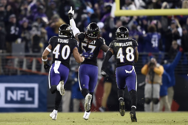 Baltimore Ravens inside linebacker C.J. Mosley, center, celebrates his interception with teammates Kenny Young, left, and Patrick Onwuasor in the second half of an NFL football game against the Cleveland Browns, Sunday, Dec. 30, 2018, in Baltimore. Baltimore Ravens won 26-24. (AP Photo/Gail Burton)