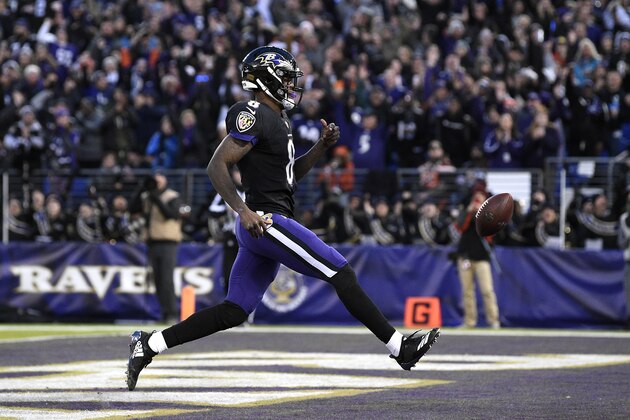 Baltimore Ravens quarterback Lamar Jackson scores a touchdown in the first half of an NFL football game against the Cleveland Browns, Sunday, Dec. 30, 2018, in Baltimore. (AP Photo/Nick Wass)