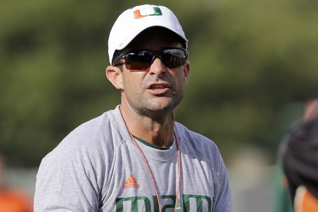 Miami defensive coordinator Manny Diaz gives instructions during NCAA college football spring practice Tuesday, March 15, 2016, in Coral Gables, Fla. (AP Photo/Alan Diaz)