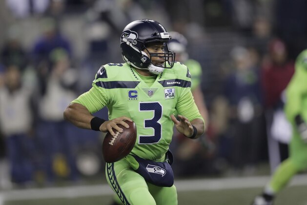 Seattle Seahawks quarterback Russell Wilson throws against the Minnesota Vikings in the first half of an NFL football game, Monday, Dec. 10, 2018, in Seattle. (AP Photo/Stephen Brashear)