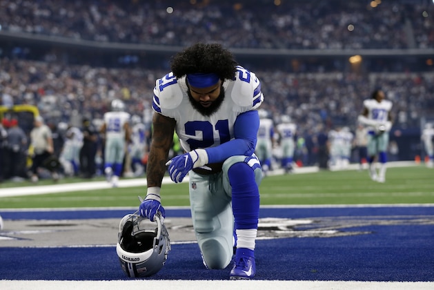 Dallas Cowboys' Ezekiel Elliott (21) kneels in the end zone at the start of an NFL football game against the Tampa Bay Buccaneers on Sunday, Dec. 23, 2018, in Arlington, Texas. (AP Photo/Roger Steinman)