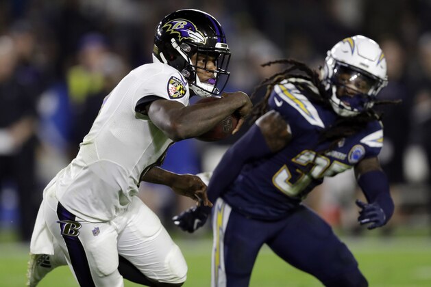File-This Dec. 22, 2018, file photo shows Baltimore Ravens quarterback Lamar Jackson running against the Los Angeles Chargers during an NFL football game  in Carson, Calif. Jackson has gotten most of the headlines, yet the former Louisville star is merely one of several rookies that have helped bring the Baltimore Ravens within striking distance of the AFC North title. (AP Photo/Marcio Jose Sanchez, File)