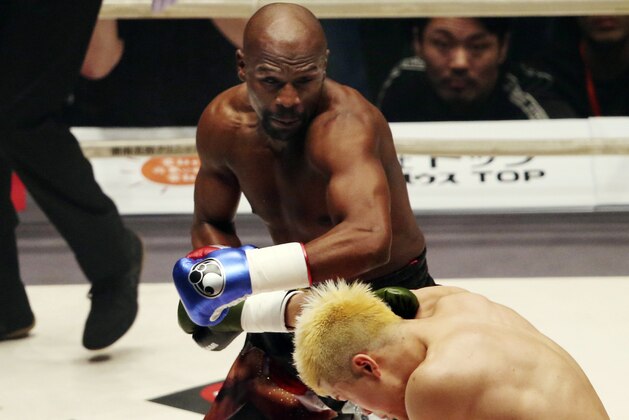 Floyd Mayweather Jr. delivers his left to Japanese kickboxer Tenshin Nasukawa, during their three-round exhibition match on New Year's Eve, at Saitama Super Arena in Saitama, north of Tokyo, Monday, Dec. 31, 2018. (AP Photo/Koji Sasahara)