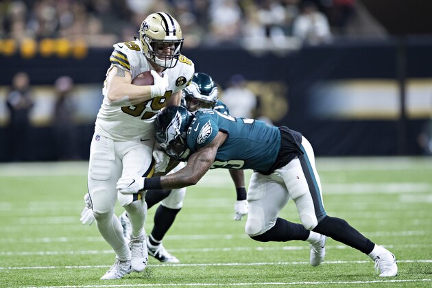 NEW ORLEANS, LA - NOVEMBER 18:  Josh Hill #89 of the New Orleans Saints is hit by Nigel Bradham #53 of the Philadelphia Eagles at Mercedes-Benz Superdome on November 18, 2018 in New Orleans, Louisiana.  The Saints defeated the Eagles 48-7.  (Photo by Wesley Hitt/Getty Images)