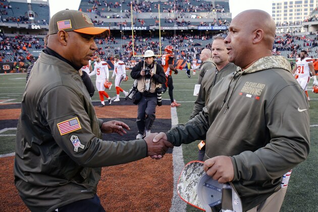 Cincinnati Bengals head coach Marvin Lewis, left, and Cleveland Browns head coach Hue Jackson meet on the field after an NFL football game, Sunday, Nov. 26, 2017, in Cincinnati. (AP Photo/Gary Landers)