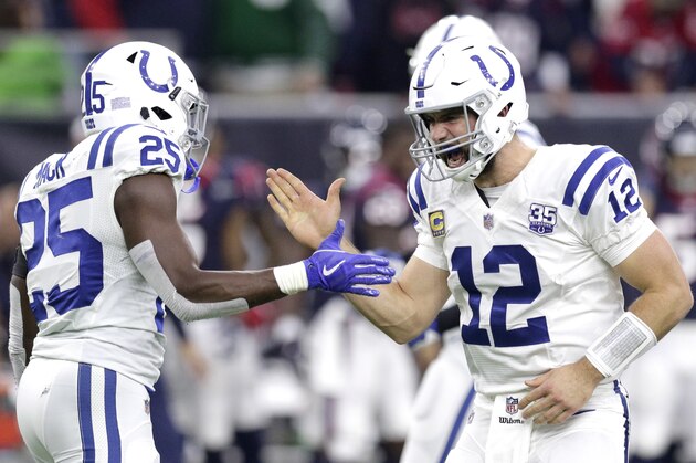 FILE - In this Sunday, Dec. 9, 2018, file photo, Indianapolis Colts quarterback Andrew Luck (12) celebrates with running back Marlon Mack (25) after securing a win against the Houston Texans in the second half of an NFL football game in Houston. In his comeback from a 2017 season lost to a shoulder injury, Luck has been sensational, working behind an offensive line that has gone from sieve to sturdy. AP Photo/Michael Wyke, File)