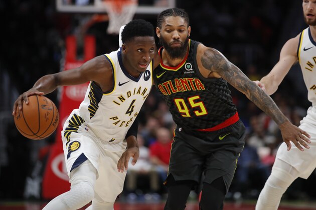 Indiana Pacers guard Victor Oladipo (4) drives to the basket as Atlanta Hawks forward DeAndre' Bembry (95) defends during the second half of an NBA basketball game Wednesday, Dec. 26, 2018, in Atlanta. (AP Photo/Todd Kirkland)