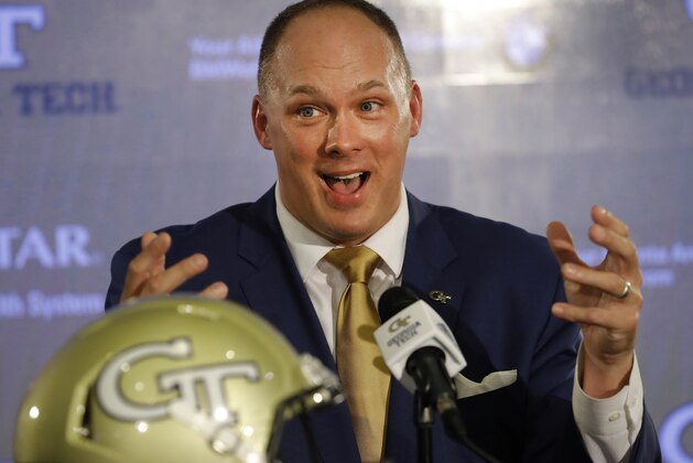 FILE - In this Dec. 7, 2018, file photo, newly hired Georgia Tech NCAA college football coach Geoff Collins speaks during a news conference in Atlanta. Collins' first signing class at Georgia Tech includes two who initially committed to other schools. Collins had 15 signees on Wednesday's, Dec. 19, 2018, first day of the early signing period, less than two weeks after being named Georgia Tech's coach. (AP Photo/John Bazemore, File) FILE - In this Dec. 7, 2018, file photo, newly hired Georgia Tech NCAA college football coach Geoff Collins speaks during a news conference in Atlanta. Collins' first signing class at Georgia Tech includes two who initially committed to other schools. Collins had 15 signees on Wednesday's, Dec. 19, 2018, first day of the early signing period, less than two weeks after being named Georgia Tech's coach. (AP Photo/John Bazemore, File)