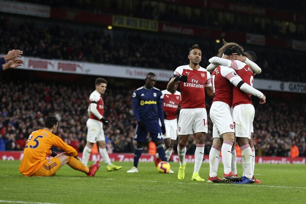 LONDON, ENGLAND - JANUARY 01: Alexandre Lacazette of Arsenal celebrates with his team mates after scoring a goal to make it 2-0 during the Premier League match between Arsenal FC and Fulham FC at Emirates Stadium on January 1, 2019 in London, United Kingdom. (Photo by James Baylis - AMA/Getty Images)