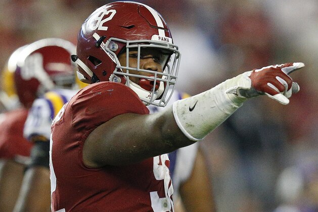 FILE - In this Nov. 4, 2017 file photo, Alabama defensive lineman Quinnen Williams celebrates after sacking LSU quarterback Myles Brennan during the second half of an NCAA college football game, in Tuscaloosa, Ala. Williams has been hot all season, really, but he was a monster in Alabama’s biggest game of the season so far against LSU. He had 10 tackles, seven solo stops, and 2½ sacks against the Tigers. (AP Photo/Brynn Anderson, File)