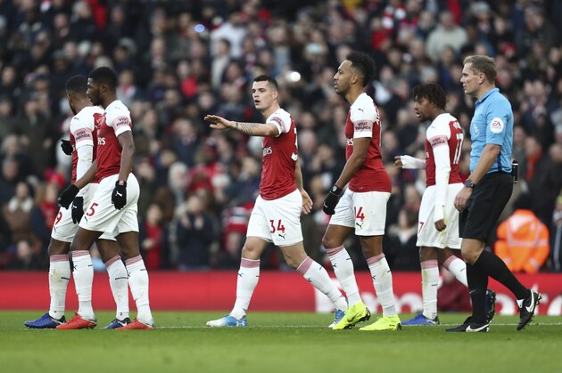 LONDON, ENGLAND - JANUARY 01: Granit Xhaka of Arsenal celebrates with his team mates after scoring a goal to make it 1-0 during the Premier League match between Arsenal FC and Fulham FC at Emirates Stadium on January 1, 2019 in London, United Kingdom. (Photo by James Baylis - AMA/Getty Images)