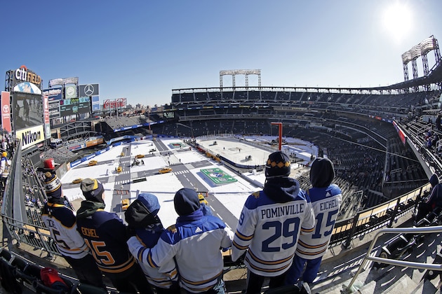Buffalo Sabres fans look on prior to the NHL Winter Classic hockey game against the New York Rangers at CitiField in New York on Monday, Jan. 1, 2018. (AP Photo/Adam Hunger)