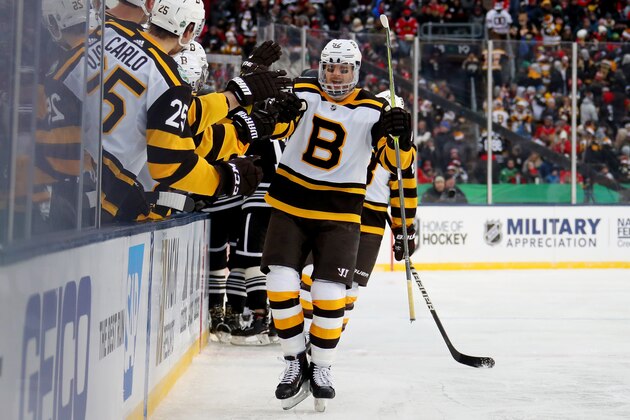 SOUTH BEND, INDIANA - JANUARY 01:  Sean Kuraly #52 of the Boston Bruins celebrates with teammates after scoring a goal in the third period against the Chicago Blackhawks during the 2019 Bridgestone NHL Winter Classic at Notre Dame Stadium on January 01, 2019 in South Bend, Indiana. (Photo by Gregory Shamus/Getty Images)