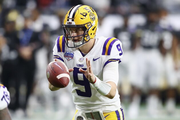 LSU quarterback Joe Burrow (9) takes the snap during the first half of a Fiesta Bowl NCAA college football game against UCF Tuesday, Jan. 1, 2019, in Glendale, Ariz. (AP Photo/Ross D. Franklin)