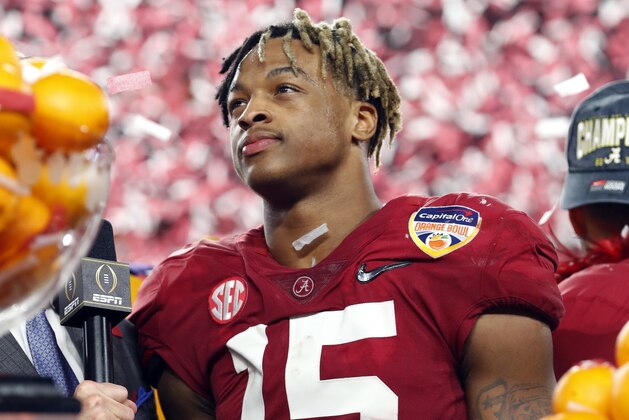 Alabama defensive back Xavier McKinney (15) stands next to the MVP trophy for the defensive player of the game during the Orange Bowl NCAA college football game, Sunday, Dec. 30, 2018, in Miami Gardens, Fla. Alabama defeated Oklahoma 45-34. (AP Photo/Wilfredo Lee)