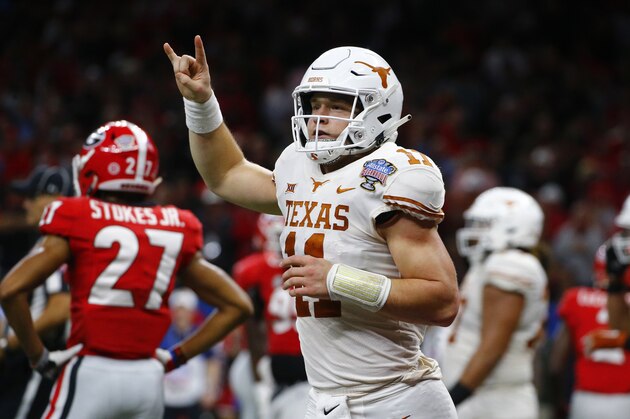 Texas quarterback Sam Ehlinger (11) celebrates his second touchdown carry in the first half of the Sugar Bowl NCAA college football game against Georgia in New Orleans, Tuesday, Jan. 1, 2019. (AP Photo/Butch Dill)