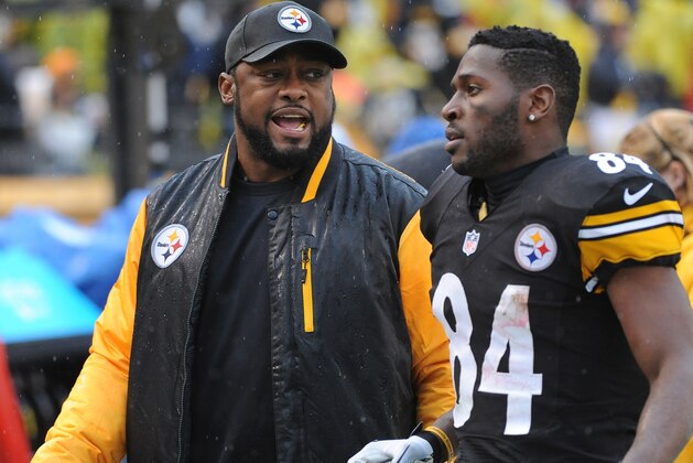 PITTSBURGH, PA - DECEMBER 29:  Head coach Mike Tomlin of the Pittsburgh Steelers talks to wide receiver Antonio Brown #84 as they walk off the field at the end of the first half during a game against the Cleveland Browns at Heinz Field on December 29, 2013 in Pittsburgh, Pennsylvania.  The Steelers defeated the Browns 20-7.  (Photo by George Gojkovich/Getty Images)