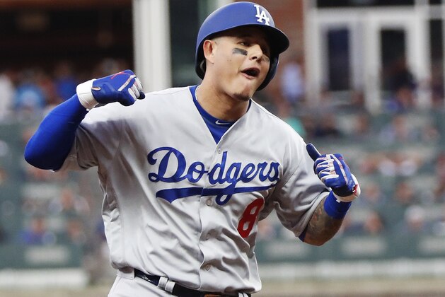 Los Angeles Dodgers' Manny Machado (8) celebrates his three-run homer against the Atlanta Braves during the seventh inning in Game 4 of baseball's National League Division Series, Monday, Oct. 8, 2018, in Atlanta. (AP Photo/John Bazemore) Los Angeles Dodgers' Manny Machado (8) celebrates his three-run homer against the Atlanta Braves during the seventh inning in Game 4 of baseball's National League Division Series, Monday, Oct. 8, 2018, in Atlanta. (AP Photo/John Bazemore)