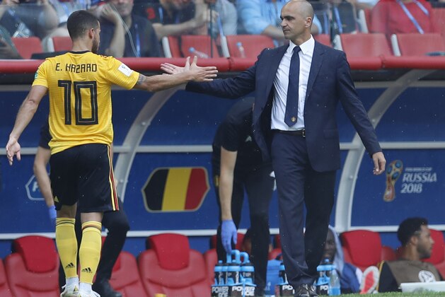 Belgium coach Roberto Martinez, right, congratulates Eden Hazard after replacing him during the group G match between Belgium and Tunisia at the 2018 soccer World Cup in the Spartak Stadium in Moscow, Russia, Saturday, June 23, 2018. (AP Photo/Hassan Ammar)