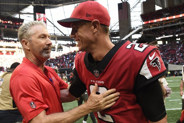 Tampa Bay Buccaneers head coach Dirk Koetter speaks with Atlanta Falcons quarterback Matt Ryan (2) after an NFL football game, Sunday, Oct. 14, 2018, in Atlanta. The Atlanta Falcons won 34-29. (AP Photo/John Amis)