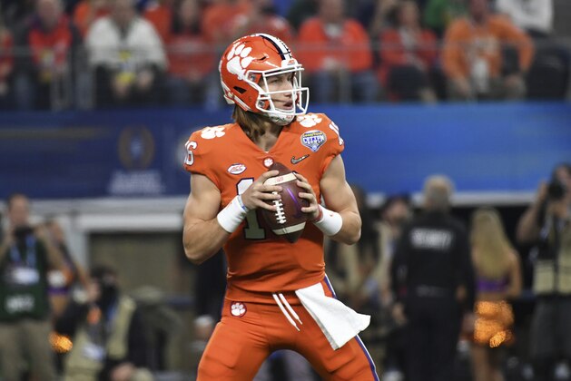 Clemson quarterback Trevor Lawrence (16) drops back to pass during the NCAA Cotton Bowl semi-final playoff football game against Notre Dame on Saturday, Dec. 29, 2018, in Arlington, Texas. (AP Photo/ Jeffrey McWhorter)