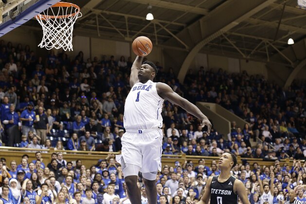 Duke's Zion Williamson (1) drives for a dunk against Stetson during the second half of an NCAA college basketball game in Durham, N.C., Saturday, Dec. 1, 2018. (AP Photo/Gerry Broome)