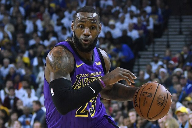 OAKLAND, CA - DECEMBER 25:  LeBron James #23 of the Los Angeles Lakers dribbles the ball up court against the Golden State Warriors during the first half of their NBA Basketball game at ORACLE Arena on December 25, 2018 in Oakland, California. NOTE TO USER: User expressly acknowledges and agrees that, by downloading and or using this photograph, User is consenting to the terms and conditions of the Getty Images License Agreement.  (Photo by Thearon W. Henderson/Getty Images)