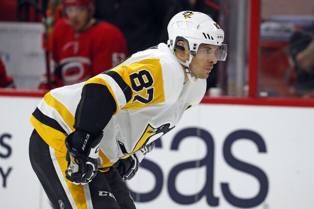 Pittsburgh Penguins' Sidney Crosby (87) waits for a face-off against the Carolina Hurricanes during the first period of an NHL hockey game, Saturday, Dec. 22, 2018, in Raleigh, N.C. (AP Photo/Karl B DeBlaker)