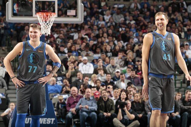 DALLAS, TX - DECEMBER 16: Luka Doncic #77 and Dirk Nowitzki #41 of the Dallas Mavericks smile during a game against the Sacramento Kings on December 16, 2018 at the American Airlines Center in Dallas, Texas. NOTE TO USER: User expressly acknowledges and agrees that, by downloading and or using this photograph, User is consenting to the terms and conditions of the Getty Images License Agreement. Mandatory Copyright Notice: Copyright 2018 NBAE (Photo by Glenn James/NBAE via Getty Images) DALLAS, TX - DECEMBER 16: Luka Doncic #77 and Dirk Nowitzki #41 of the Dallas Mavericks smile during a game against the Sacramento Kings on December 16, 2018 at the American Airlines Center in Dallas, Texas. NOTE TO USER: User expressly acknowledges and agrees that, by downloading and or using this photograph, User is consenting to the terms and conditions of the Getty Images License Agreement. Mandatory Copyright Notice: Copyright 2018 NBAE (Photo by Glenn James/NBAE via Getty Images)