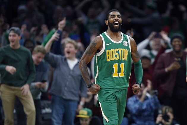 Boston Celtics' Kyrie Irving reacts after making a three-pointer in overtime during an NBA basketball game against the Philadelphia 76ers in Boston, Tuesday, Dec. 25, 2018. (AP Photo/Michael Dwyer)