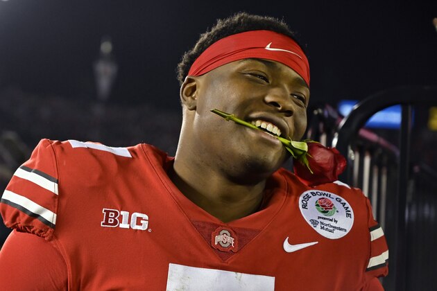 Ohio State quarterback Dwayne Haskins smiles, with a rose between his teeth, after Ohio State defeated Washington 28-23 in the Rose Bowl NCAA college football game Tuesday, Jan. 1, 2019, in Pasadena, Calif. (AP Photo/Mark J. Terrill)