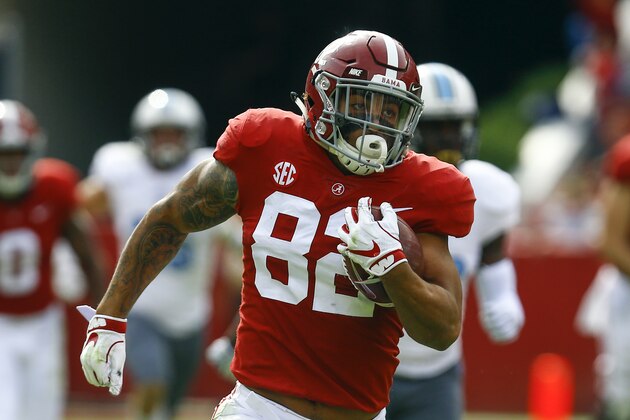 Alabama tight end Irv Smith Jr. (82) carries the ball in for a touchdown against Citadel during the second half of an NCAA college football game, Saturday, Nov. 17, 2018, in Tuscaloosa, Ala. (AP Photo/Butch Dill)