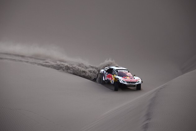 Peugeot's French driver Sebastien Loeb and co-driver Daniel Elena from Monaco compete before being forced to abandon after running into sand trouble and Elena suffering an injury, during the 2018 Dakar Rally Stage 5 between San Juan De Marcona and Arequipa in Peru, on January 10, 2018.
Sebastien Loeb was forced to pull out of the Dakar Rally after a back injury suffered by his co-driver in a disastrous fifth stage won by defending champion Stephane Peterhansel. / AFP PHOTO / Franck FIFE        (Photo credit should read FRANCK FIFE/AFP/Getty Images)
