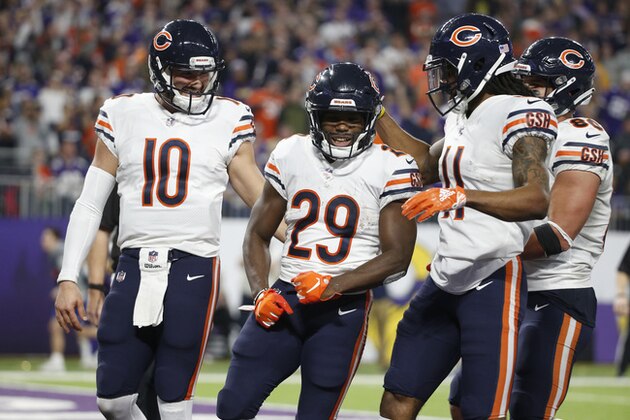 Chicago Bears running back Tarik Cohen (29) celebrates with teammates Mitchell Trubisky (10) and Kevin White (11) after scoring on a 3-yard touchdown run during the second half of an NFL football game against the Minnesota Vikings, Sunday, Dec. 30, 2018, in Minneapolis. (AP Photo/Bruce Kluckhohn)