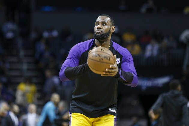 Los Angeles Lakers forward LeBron James warms up during halftime as Los Angeles plays the Charlotte Hornets in the second half of an NBA basketball game in Charlotte, N.C., Saturday, Dec. 15, 2018. Los Angeles won 128-100. (AP Photo/Nell Redmond)