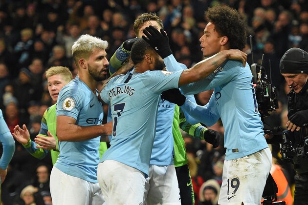 Manchester City's German midfielder Leroy Sane (R) celebrates with teammates after scoring their second goal during the English Premier League football match between Manchester City and Liverpool at the Etihad Stadium in Manchester, north west England, on January 3, 2019. (Photo by Oli SCARFF / AFP) / RESTRICTED TO EDITORIAL USE. No use with unauthorized audio, video, data, fixture lists, club/league logos or 'live' services. Online in-match use limited to 120 images. An additional 40 images may be used in extra time. No video emulation. Social media in-match use limited to 120 images. An additional 40 images may be used in extra time. No use in betting publications, games or single club/league/player publications. /         (Photo credit should read OLI SCARFF/AFP/Getty Images)