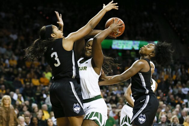 Connecticut guard/forward Megan Walker (3) defends Baylor center Kalani Brown (center) as Christyn Williams, right, looks on during the first half of an NCAA college basketball game on Thursday, Jan. 3, 2019, in Waco, Texas. (AP Photo/Ray Carlin)