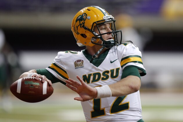 FILE - In this Saturday, Oct. 6, 2018, file photo, North Dakota State quarterback Easton Stick warms up before an NCAA college football game against Northern Iowa, in Cedar Falls, Iowa. North Dakota State begins its hunt for its seventh Football Championship Subdivision title in eight years with a familiar ingredient on offense: a high-quality quarterback with plenty of experience in senior Stick. (AP Photo/Charlie Neibergall, File)