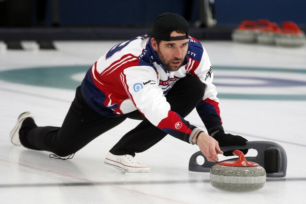 In this Jan. 3, 2019 photo, former Minnesota Vikings football player Jared Allen practices with his curling team for a competition in Blaine, Minn. Allen retired from the NFL in 2015 and wasn't ready to give up on the competition he'd come to enjoy as a five-time All-Pro in a 12-year career. His solution: Make it to the 2022 Olympics _ in curling. Less than a year later, he and three other former NFL players who have never curled before will attempt to qualify for the U.S. championships against curlers who have been throwing stones for most of their lives. (AP Photo/Jim Mone)