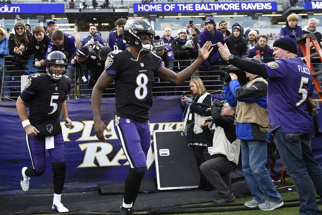 Baltimore Ravens quarterbacks Lamar Jackson (8) and Joe Flacco (5) run onto the field before an NFL football game against the Cleveland Browns, Sunday, Dec. 30, 2018, in Baltimore. (AP Photo/Nick Wass)