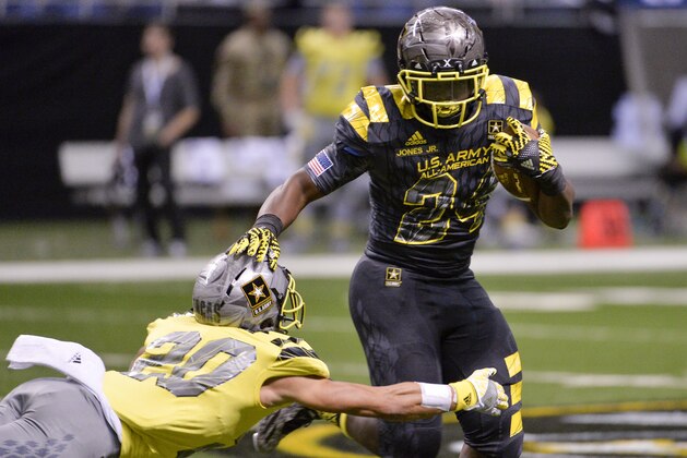 East running back Tony Jones, Jr. (24) evades West defensive back Chase Lucas during the first half of the Army All American Bowl high school football game, Saturday, Jan. 9, 2016, in San Antonio. (AP Photo/Darren Abate)