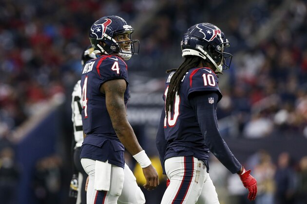 HOUSTON, TX - DECEMBER 30:  Deshaun Watson #4 of the Houston Texans and DeAndre Hopkins #10 walk to the sideline in the second half against the Jacksonville Jaguars at NRG Stadium on December 30, 2018 in Houston, Texas.  (Photo by Tim Warner/Getty Images)